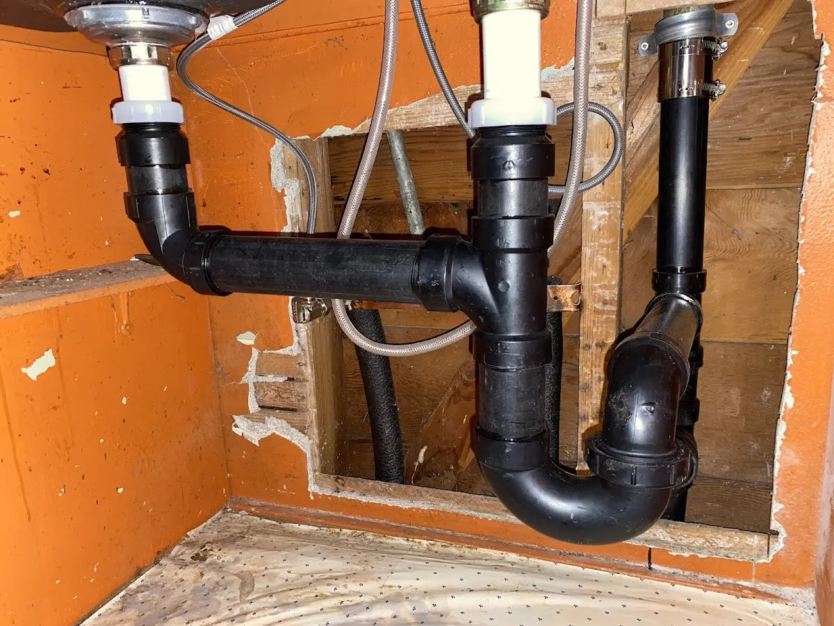 Professional Garbage Disposal Repair equipment and tools on the job in Lowell